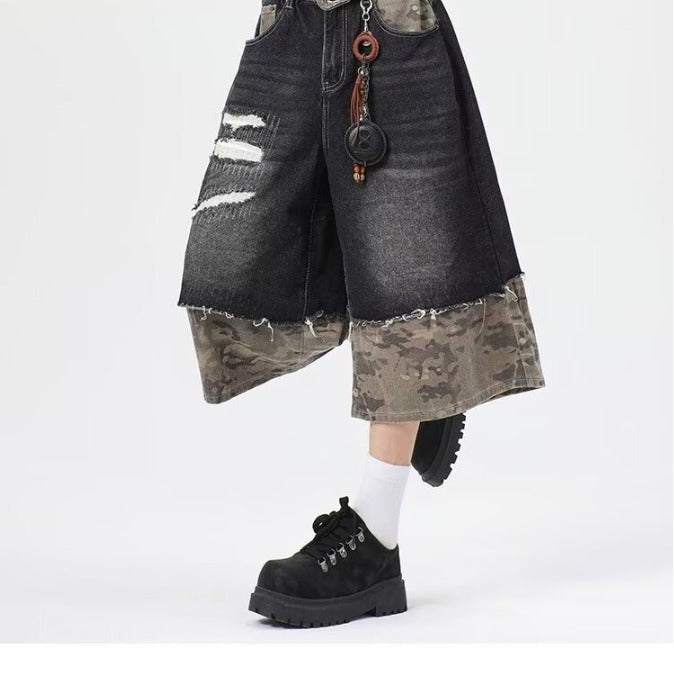 Wear and tear denim shorts with torn stitching