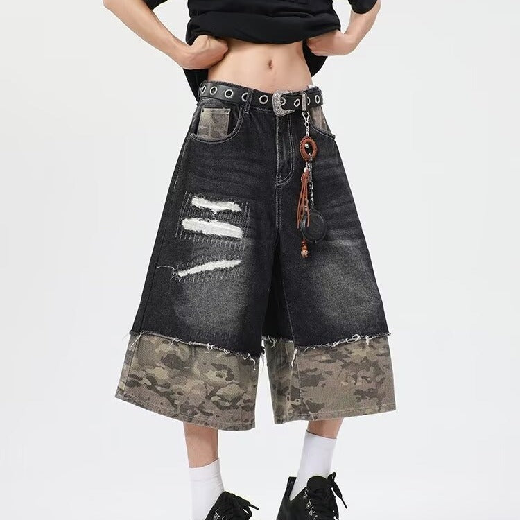 Wear and tear denim shorts with torn stitching