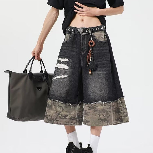 Wear and tear denim shorts with torn stitching