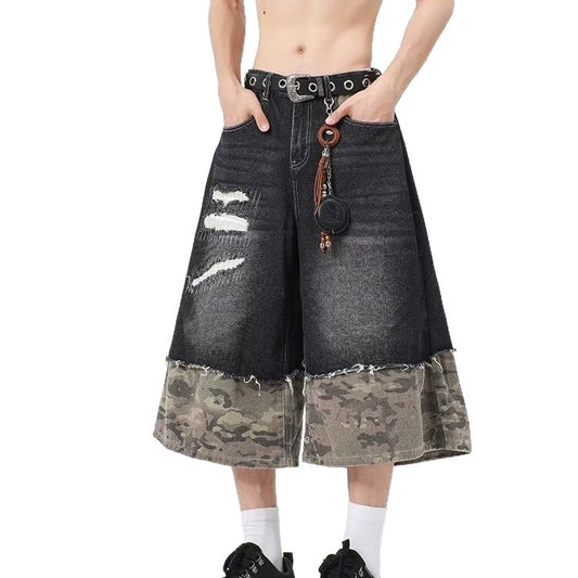 Wear and tear denim shorts with torn stitching