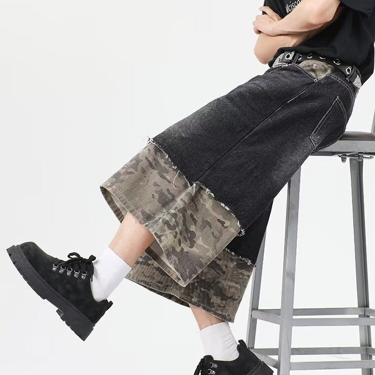 Wear and tear denim shorts with torn stitching