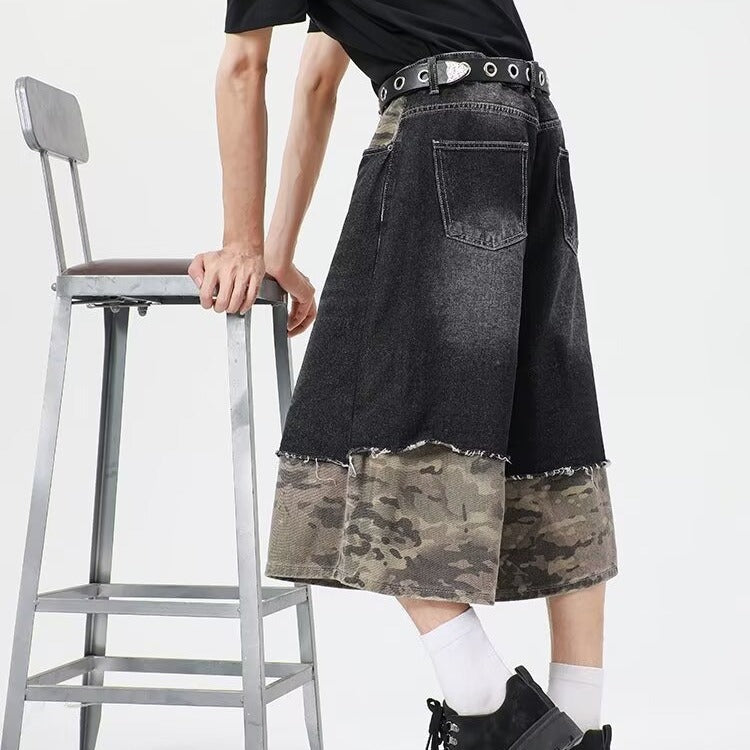 Wear and tear denim shorts with torn stitching